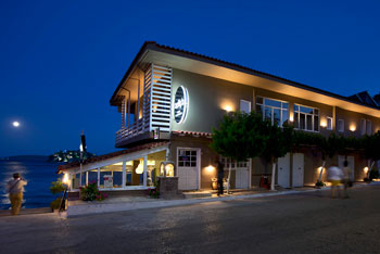 Nelly's Hotel Tolo Building Exterior at Night